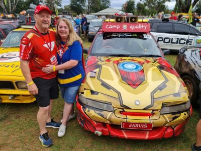 Brett Norton (Ironman), Cathy Norton (Supergirl), and ‘Jarvis’ the Holden on an esCarpade with Camp Quality. Photo: Brett Norton.